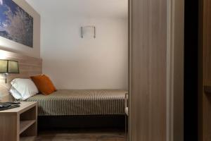 Llit o llits en una habitació de Hotel Del Pui