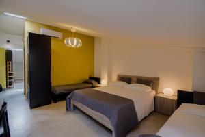 Postel nebo postele na pokoji v ubytování La Scivola Rooms