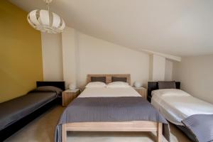 Postel nebo postele na pokoji v ubytování La Scivola Rooms