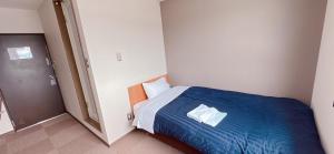 Postel nebo postele na pokoji v ubytování World Business Hotel