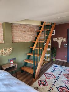 a bedroom with a staircase next to a brick wall at Karaköy in Karaköy in Istanbul