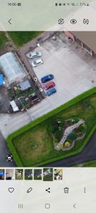 an aerial view of a parking lot with cars at peaceful one bedroom apartment in Antrim