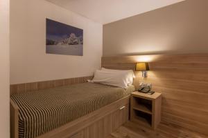 Llit o llits en una habitació de Hotel Del Pui