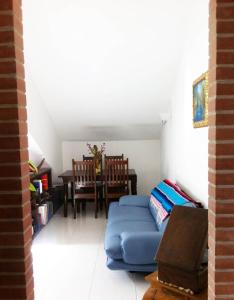 a living room with a blue couch and a table at IRIDEA COUNTRY in Potenza