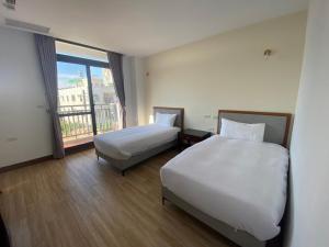 Krevet ili kreveti u jedinici u objektu 浯島文旅WD Hotel