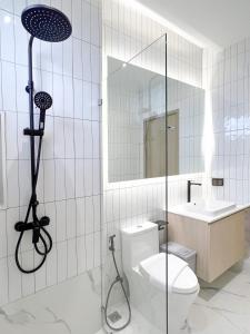 a bathroom with a toilet and a sink at Harmonic HuaHin Pool Villa-3BR, 3 Bath, 2 Kitchen in Hua Hin