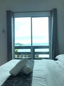 Postel nebo postele na pokoji v ubytování Langkawi Primrose