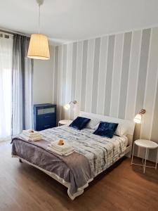 Una cama o camas en una habitación de Alloggio turistico da Elide