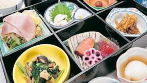 a bunch of different plates of food in bowls at Sannouzan Onsen Zuisenkyo in Ichinoseki