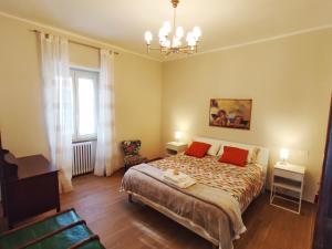 Una cama o camas en una habitación de Alloggio turistico da Elide