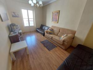 a living room with a couch and a table at Cesar Apartment in Alicante