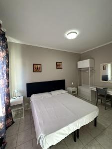 Postel nebo postele na pokoji v ubytování Hotel Le Rose
