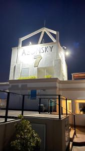 a building with a sign on the top of it at Luxury Apartment near airport in Negombo