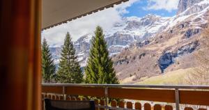 a view of a mountain from a balcony at ABA-Sporting Apartment House in Leukerbad