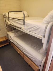 a pair of bunk beds in a room at Snow Ski Apartments 04 in Falls Creek