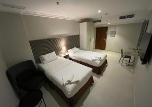 Letto o letti in una camera di Times Square Suite Hotel