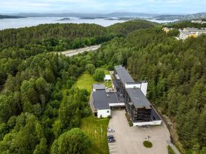 an aerial view of a building in the middle of a forest at Quality Hotel Entry in Kolbotn