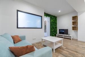 Televízia a/alebo spoločenská miestnosť v ubytovaní ApartUP Ruzafa Vertical