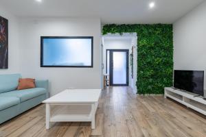 Televízia a/alebo spoločenská miestnosť v ubytovaní ApartUP Ruzafa Vertical