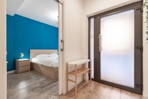 Posteľ alebo postele v izbe v ubytovaní ApartUP Ruzafa Vertical