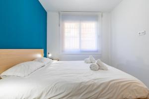 Posteľ alebo postele v izbe v ubytovaní ApartUP Ruzafa Vertical