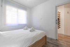 Posteľ alebo postele v izbe v ubytovaní ApartUP Ruzafa Vertical