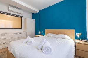 Posteľ alebo postele v izbe v ubytovaní ApartUP Ruzafa Vertical