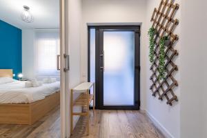 Posteľ alebo postele v izbe v ubytovaní ApartUP Ruzafa Vertical