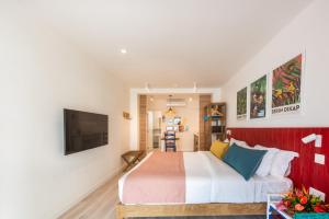 Кровать или кровати в номере Dodo Square Residence