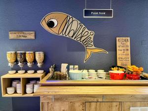 a counter with a fish sign on a wall at ibis budget Marseille Vieux Port in Marseille