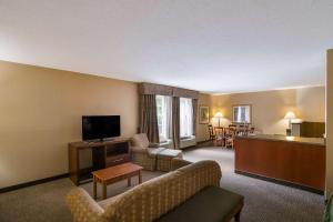 a living room with a couch and a television at Quality Inn Mystic-Groton in Mystic