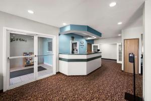 a lobby with a waiting area in a hospital at Econo Lodge Inn & Suites Mesquite - Dallas East in Mesquite
