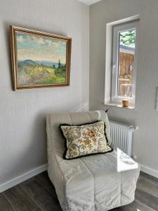 Ένα ή περισσότερα κρεβάτια σε δωμάτιο στο Ferienhaus Great Granny s Cottage