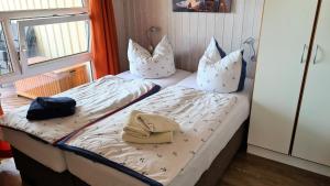 Ένα ή περισσότερα κρεβάτια σε δωμάτιο στο Ferienhaus Nordlicht