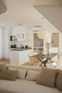 a living room with a couch and a table at Vienna Heights Premium Apartments in Vienna