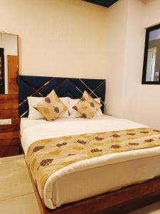 Postel nebo postele na pokoji v ubytování Hotel Maan Palace