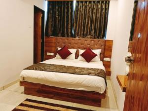 Postel nebo postele na pokoji v ubytování Hotel Maan Palace