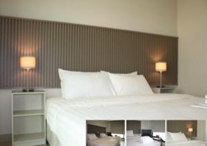 Letto o letti in una camera di Times Square Suite Hotel
