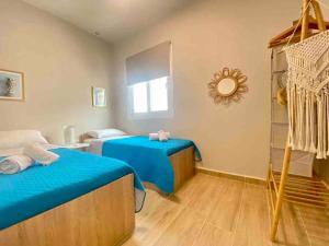 Posteľ alebo postele v izbe v ubytovaní Boho Natural Beachfront Detached House