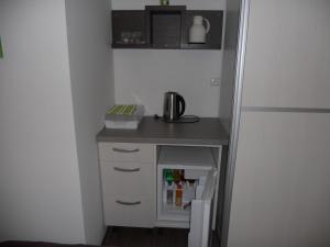 Kuchyň nebo kuchyňský kout v ubytování Apple Line Appartments