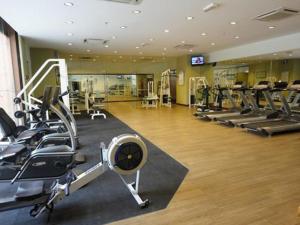 a gym with treadmills and ellipticals in a room at Marmaid Suite At Barjaya Time Square KL in Kuala Lumpur