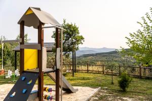 a playground with a slide in a yard at Casa de turismo rural Sardom2 in Bembibre