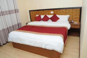 Letto o letti in una camera di Hotel Bagmati
