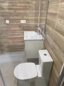 a bathroom with a toilet and a sink at New villa, 2 bedrooms private heated pool sleeps up to 6 in Pilar de la Horadada