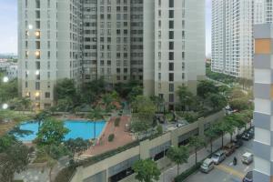 arial view of a city with a pool and buildings at Cozy 2 Bedroom Condo in Masteri Thao Dien, Fully Furnished With Full Amenities in Ho Chi Minh City