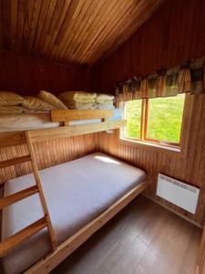 Una cama o camas en una habitación de Hálsabol Sumarhús- with hot tube