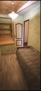 a room with a bed and a staircase in it at Appartement au pied du château in Montbéliard