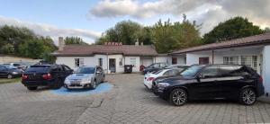 a group of cars parked in front of a building at AGIRIJA 