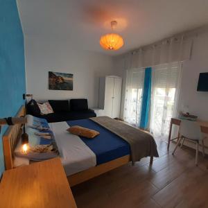 Postel nebo postele na pokoji v ubytování ARIEL ROOMS