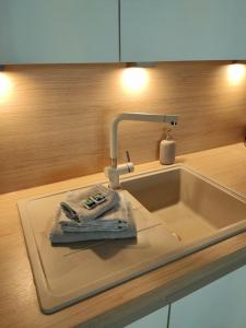 a kitchen sink with a towel and a faucet at Sea-LeVel in Ostend